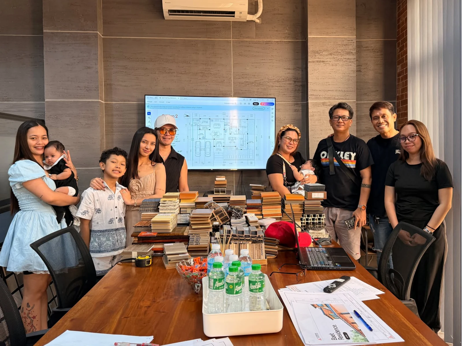 IG Sabroso team and clients gathered for a project presentation with material samples